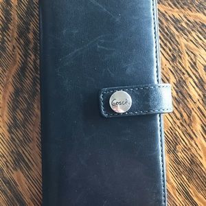 Black leather Coach checkbook holder